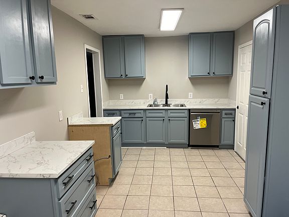Kitchen has new cabinets, dish washer and a new gas range.