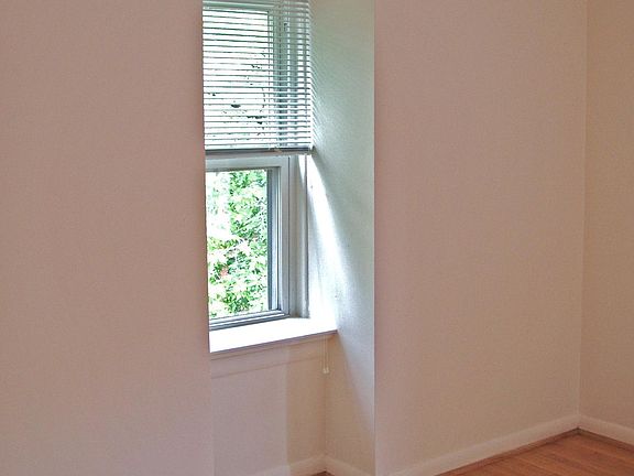 Bedroom with front window. Bedroom has two windows.