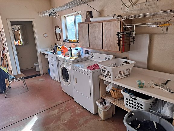 Washer and dryer and half bath in garage.