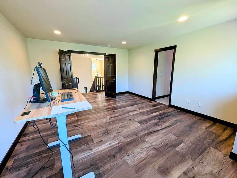 Spacious Master bd. Comfortably fits a large California King bed with side tables and chest.