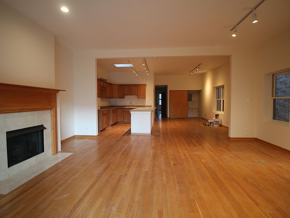 Large living room, gas fireplace, wood floors