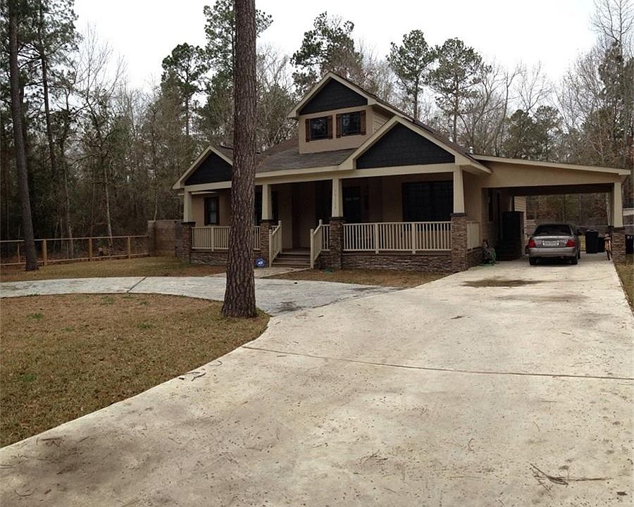Concrete circle Drive; Stone; Hardi and Stucco Exterior on Pier and Beam