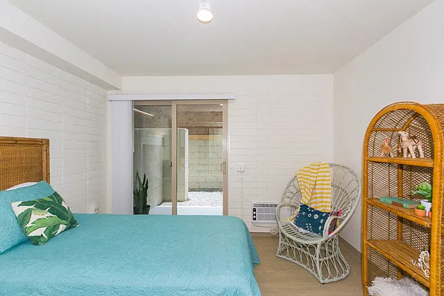 Kanekapolei Collection Bedroom with mirror doored closets and decor