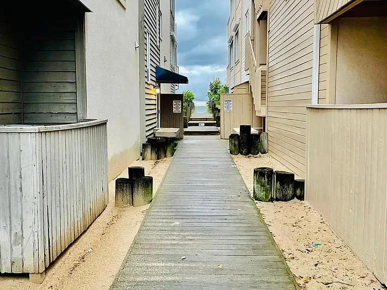 Walk to the beach between the two buildings