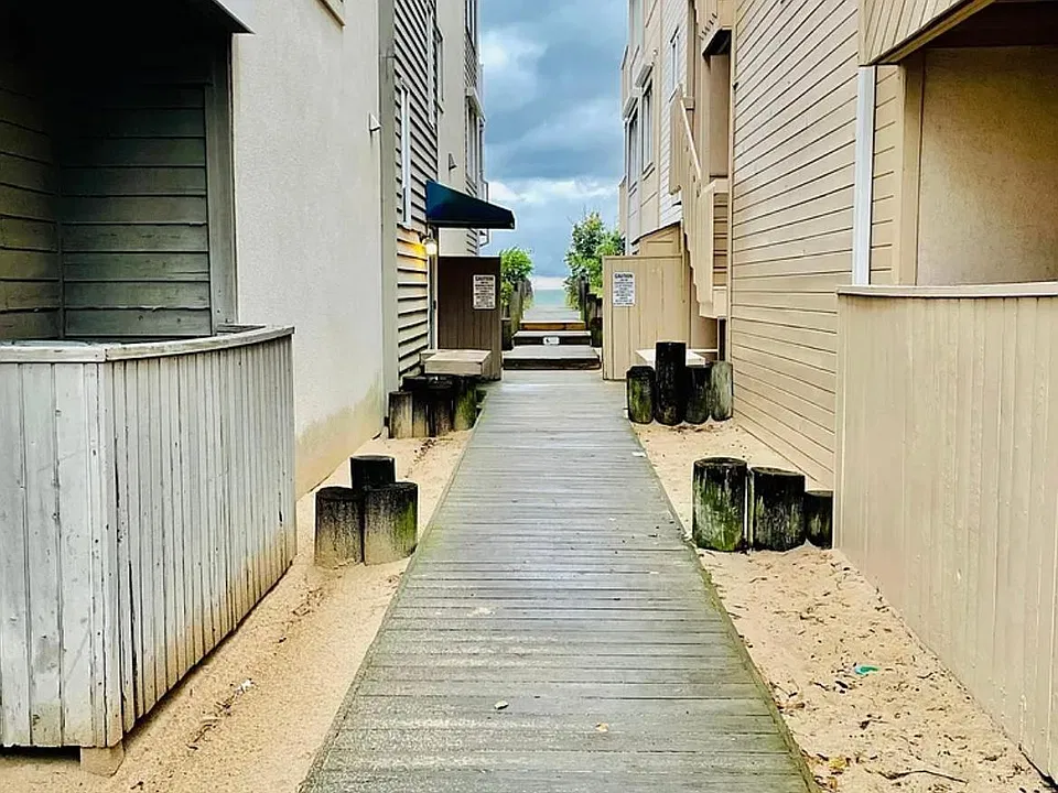 Walk to the beach between the two buildings