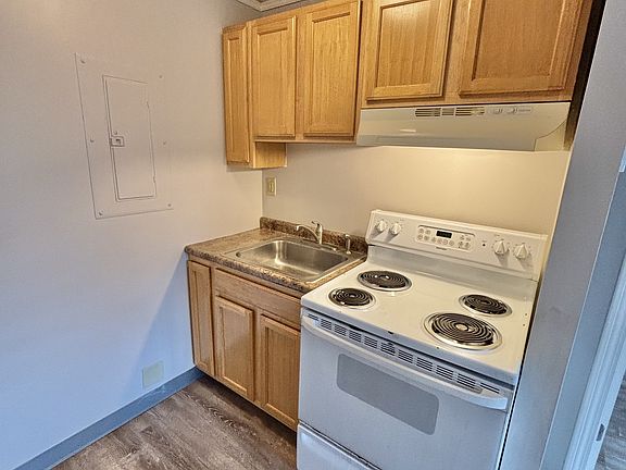 Kitchen with full sized oven and full sized fridge