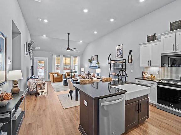 Accomplished layout with a first-class kitchen in this select townhome community by DRB Homes