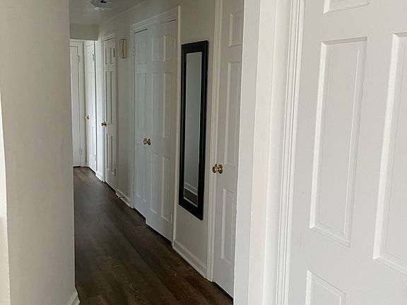 Hallway is lined with closets.