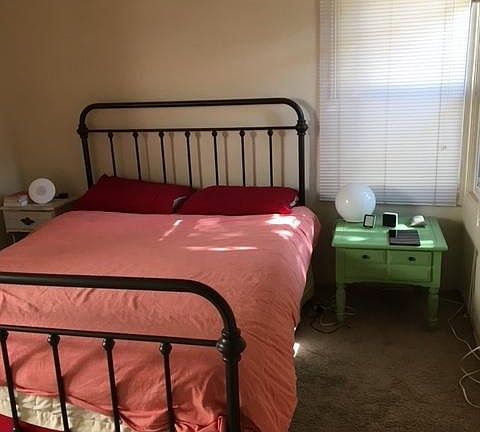 Master Bedroom before hardwood floors refinished and vinyl windows installed