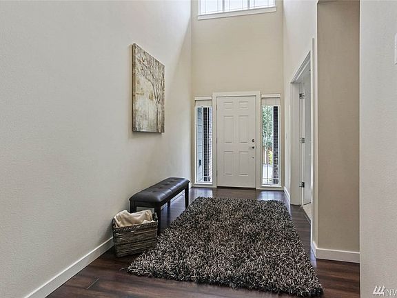 Another look at the bright entry with high ceilings and windows.