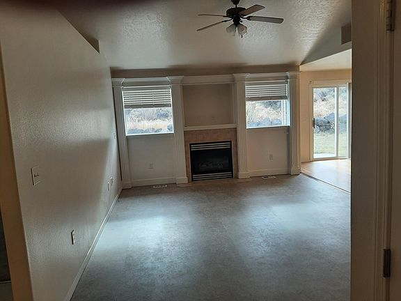 Living room with fireplace and Luxury Vinyl Tile flooring
