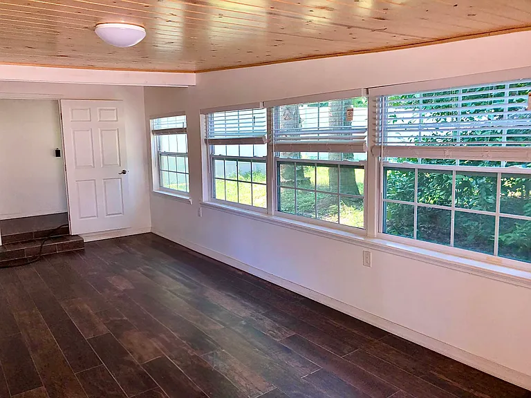 Bedroom 2, view of back yard with orange trees