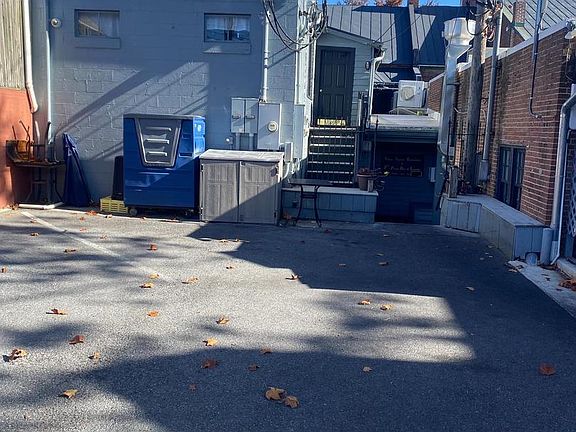 Rear of building with parking. Facing Indian Alley.