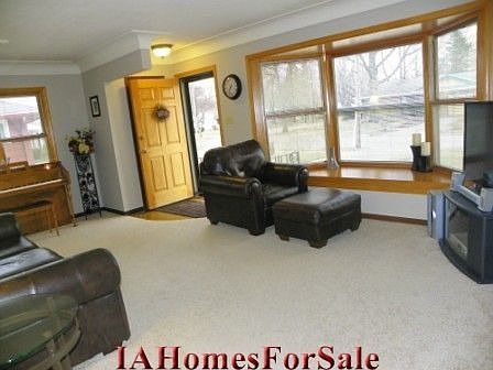 Living Room: Large living room with crown molding, fresh paint, and a large bay window for lots of natural light.  Pella windows feature blinds within the window, which means no cords or dusting!