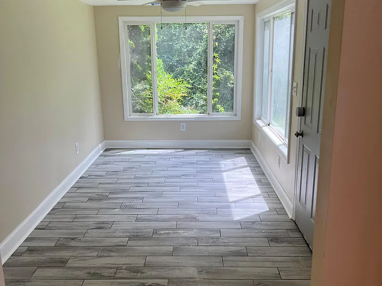 Sun-filled bonus space overlooking the large backyard _ ideal for morning coffee or quiet evenings.