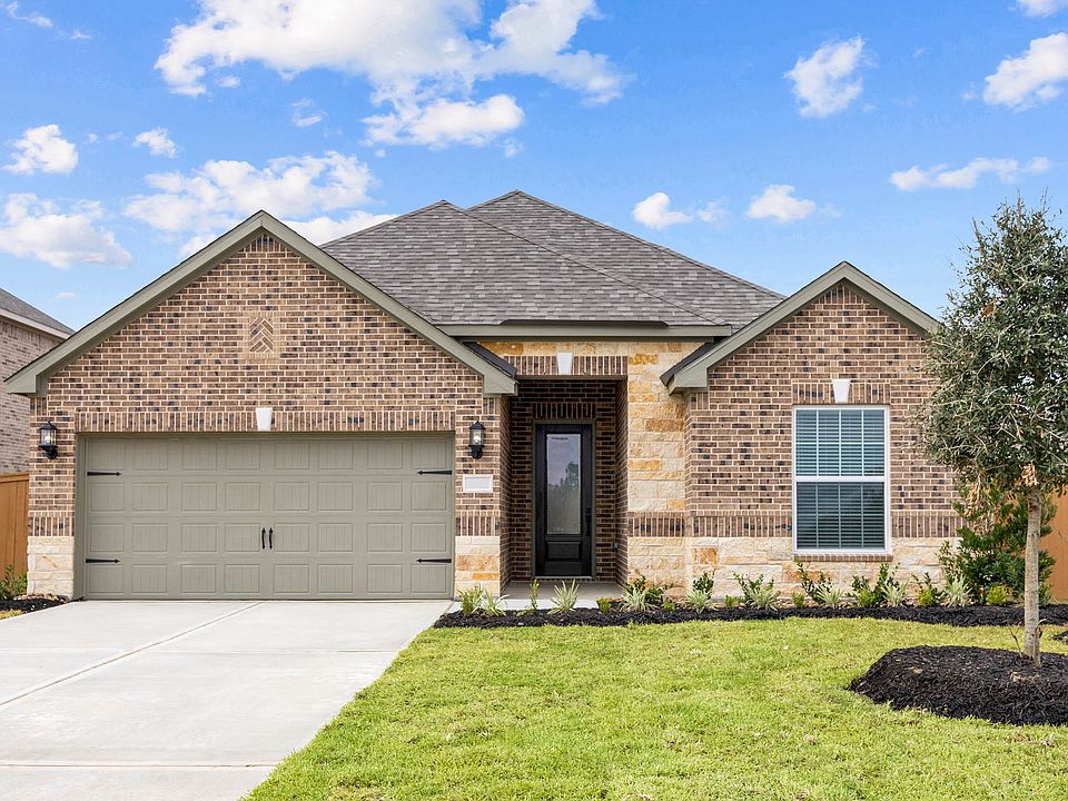 The Reed is a single story home with brick.