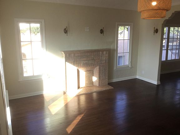 EXPANSIVE LIVING ROOM WITH VINTAGE HARDWARE