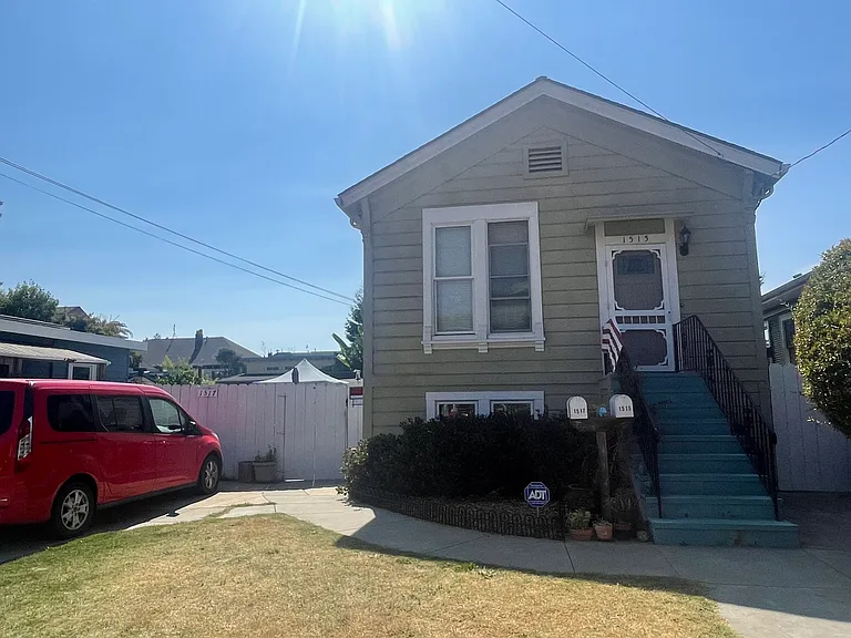 The front house. Access to the cottage is through the fence on the left.