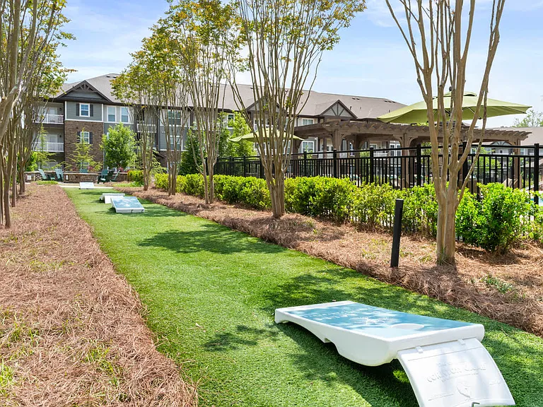 Outdoor Lounge with Cornholes