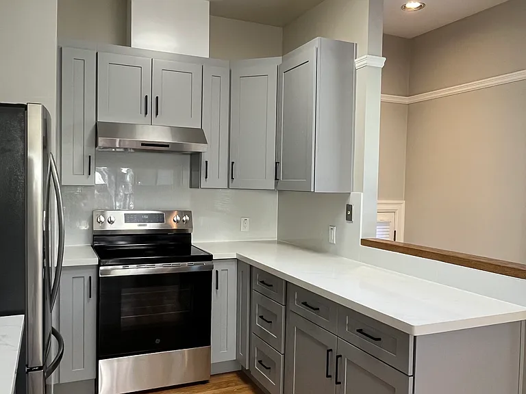 New electric range and hood, quartz counters