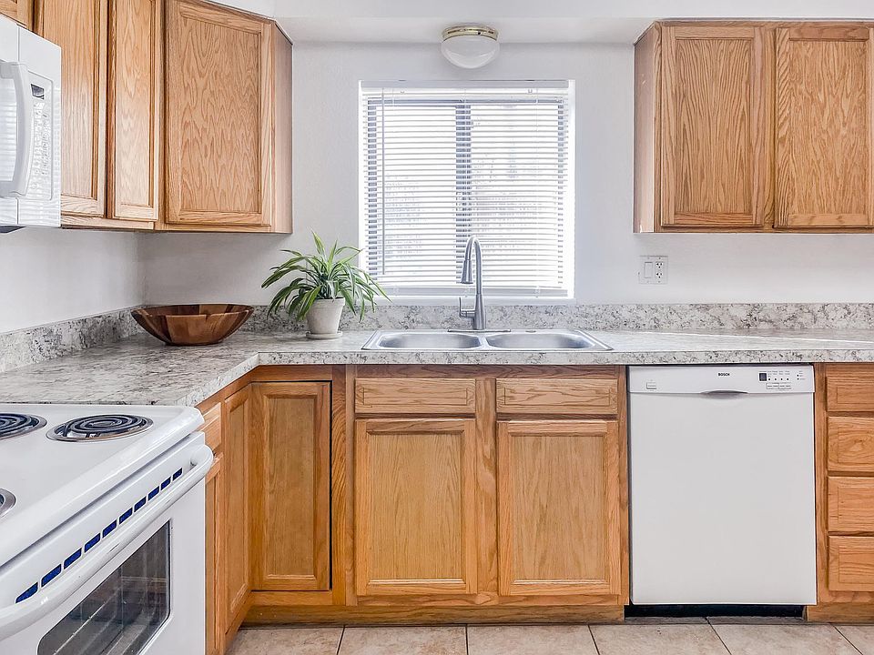 Huge kitchen with plenty of storage and floor tile throughout.