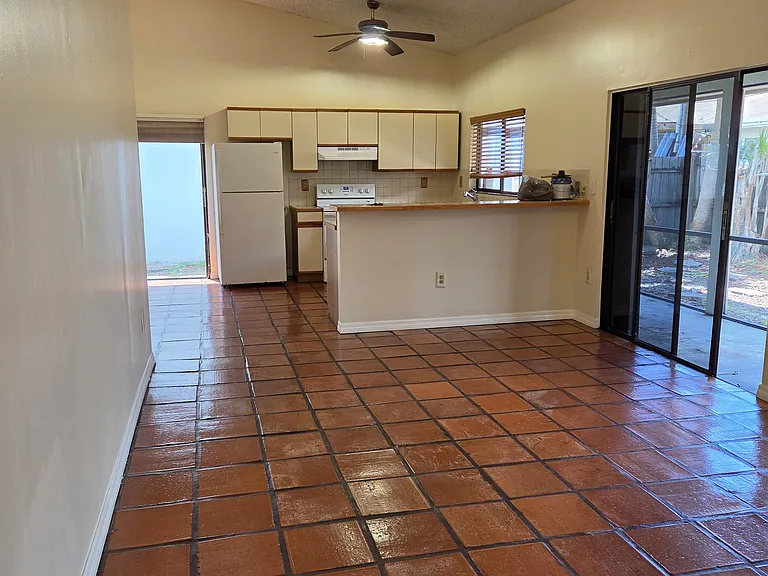 Front door walking into living area and then kitchen