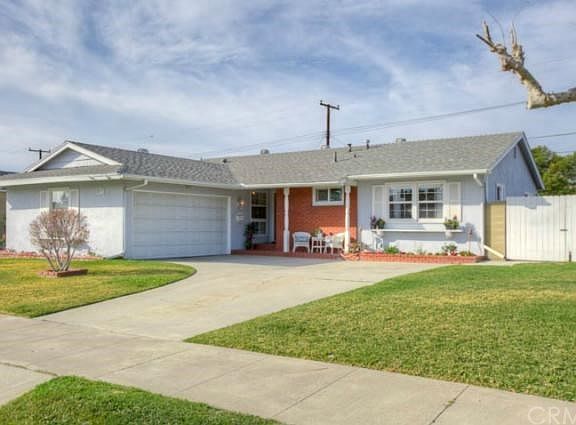 Curved driveway, room for 3 cars, plus a 2 car garage