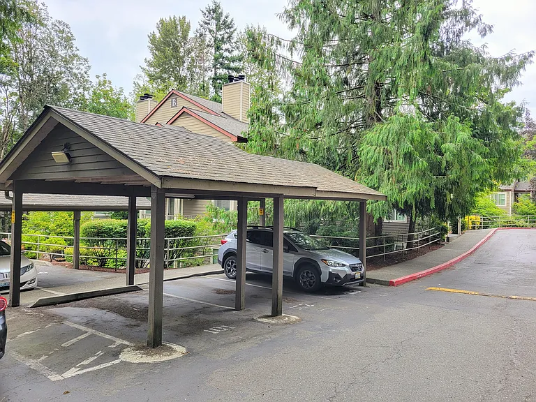Reserved covered parking space #1 with B Building in the background.