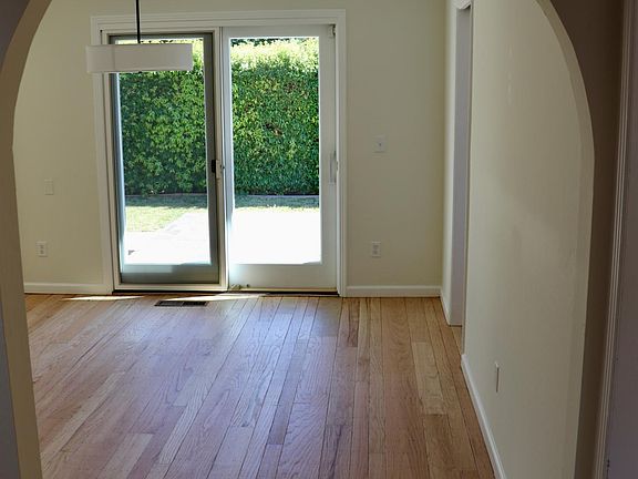 Formal dining room situated between kitchen and living room, and with access to the beautiful outdoors