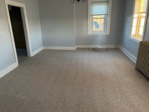 Living room, connects to den/office