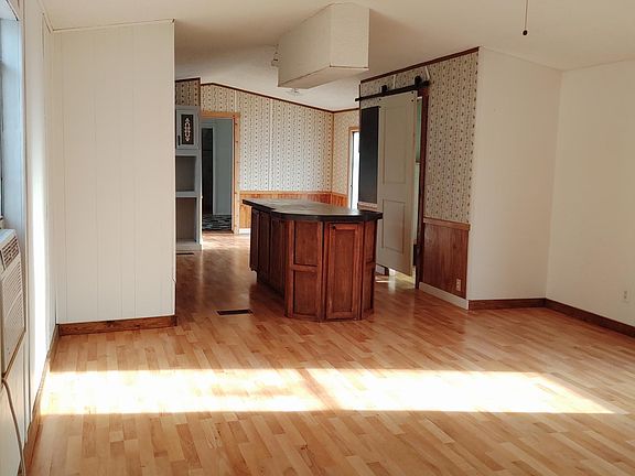 View of living room and kitchen from front door