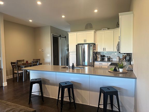 Large kitchen island for 3-5 bar stools plus separate space for kitchen table