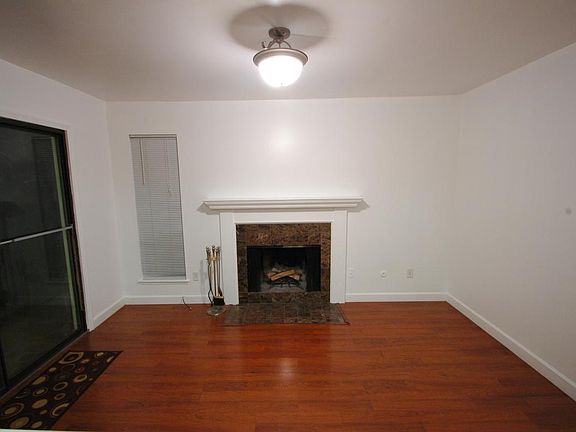 Den has Fireplace with Marble Surround