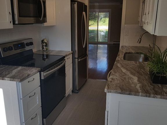 Remodelled kithen with granite countertops, new cabinets wit