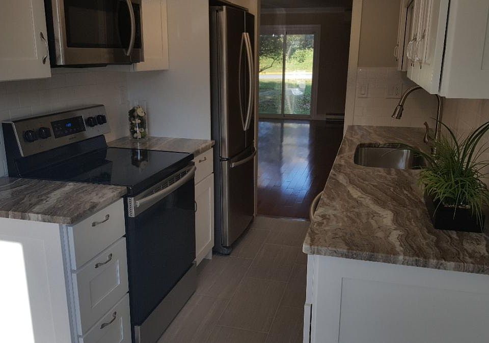 Remodelled kithen with granite countertops, new cabinets wit