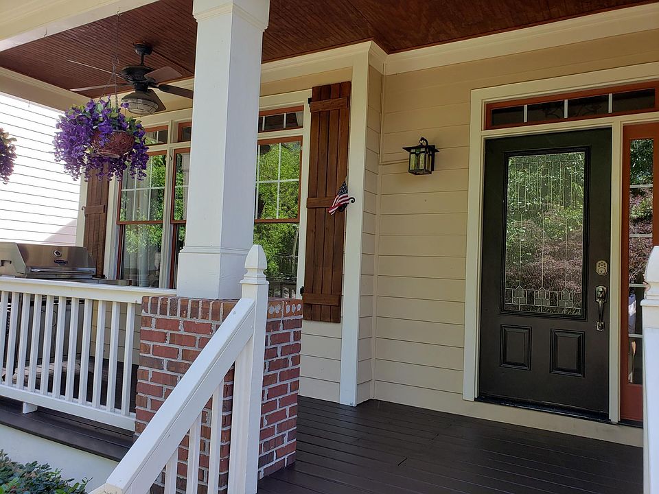Welcoming covered front porch with natural gas grill. Never run out of propane again!