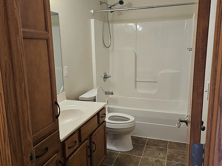 Full Second Bath with Large Cabinet for Storage