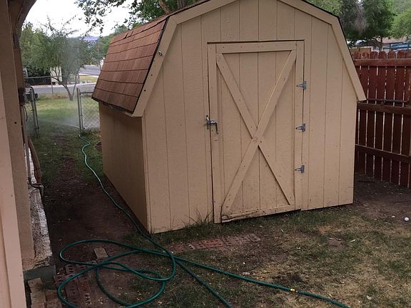8x12 storage shed fenced yard must be taken care of if you don't like yard work or keeping the grass watered this wont be for you