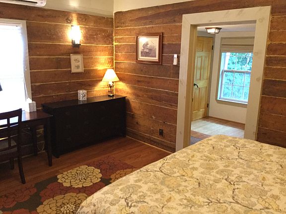 The primary suite includes a separate dressing room with natural light, garden views, and full-size washer and dryer.