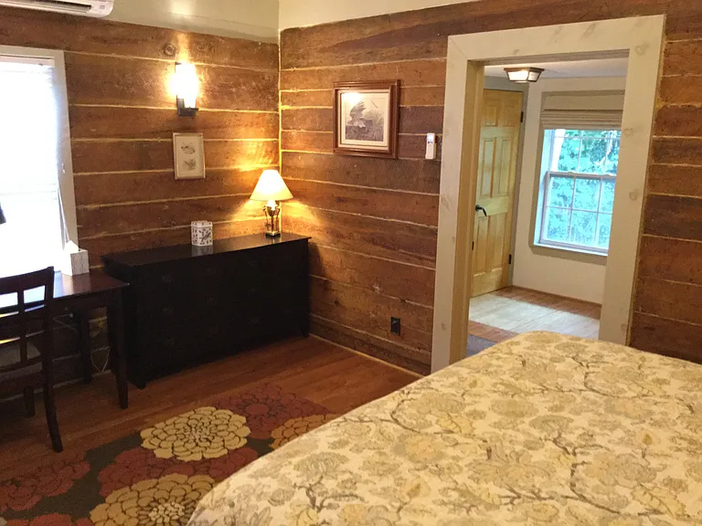 The primary suite includes a separate dressing room with natural light, garden views, and full-size washer and dryer.