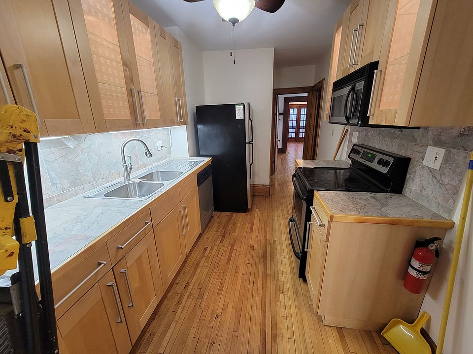 Kitchen with stainless steel appliances, updated cabinets, and dishwasher.