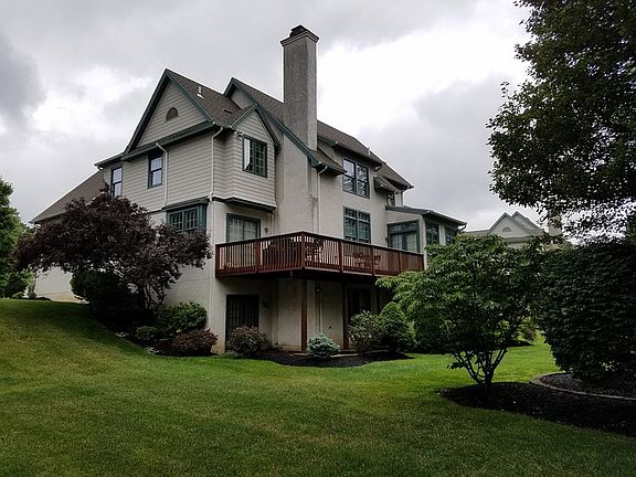Backyard : Expanded deck and paved patio below with walkout access from the basement.