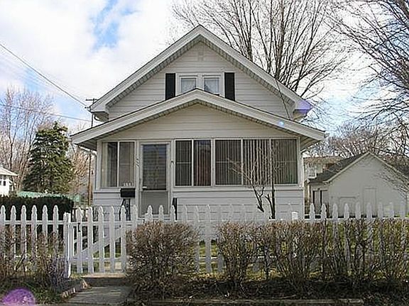 Front view of home and the white picket fence