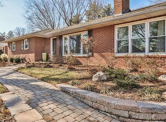 Inviting brick paver walk leads to front door