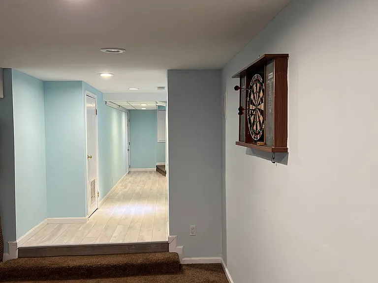 Angle from living room to hallway. Dart board can either stay or go.