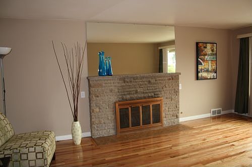 Fireplace in living room with view of Pugeot Sound!