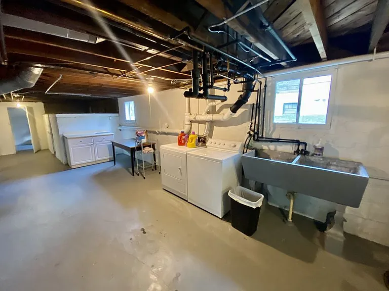 Basement with washer/dryer and utility sink (you get your own washer and dryer, they are not shared. Not coin). Basement also includes lockable storage room.