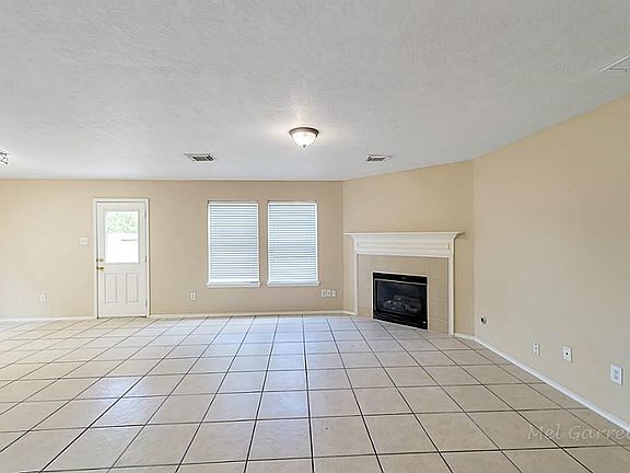 large open den with gaslog fireplace