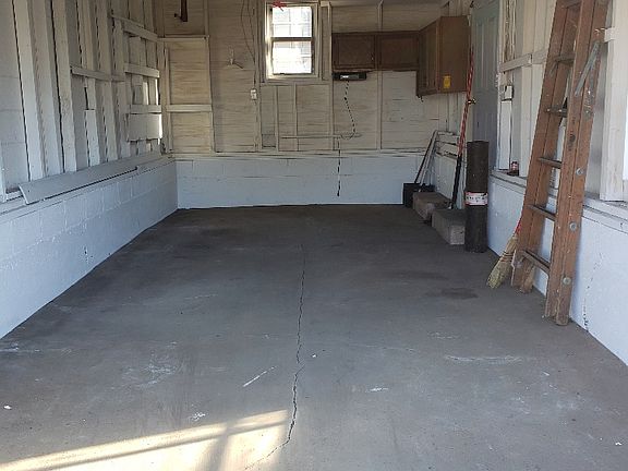 One car detached garage with opener.