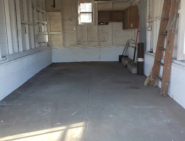 One car detached garage with opener.